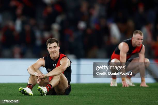 Zach Merrett of the Bombers and Nick Hind of the Bombers look dejected after the round 20 AFL match between Essendon Bombers and Sydney Swans at...