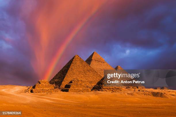 pyramid complex of giza under the rainbow. giza, cairo, egypt - khufu stock pictures, royalty-free photos & images