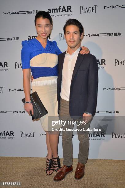 Cousins Lily Kwong and Joseph Altuzarra attend the amfAR Inspiration Miami Beach Party on December 6, 2012 in Miami Beach, United States.