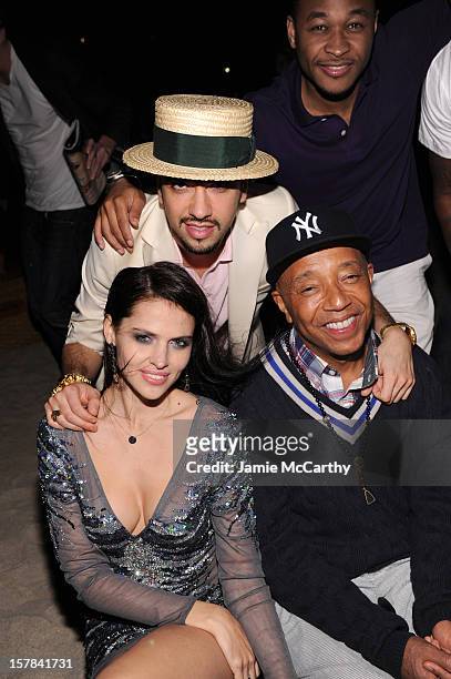 Hana Nitsche, DJ Cassidy and Russell Simmons attend the amfAR Inspiration Miami Beach Party at Soho Beach House on December 6, 2012 in Miami Beach,...