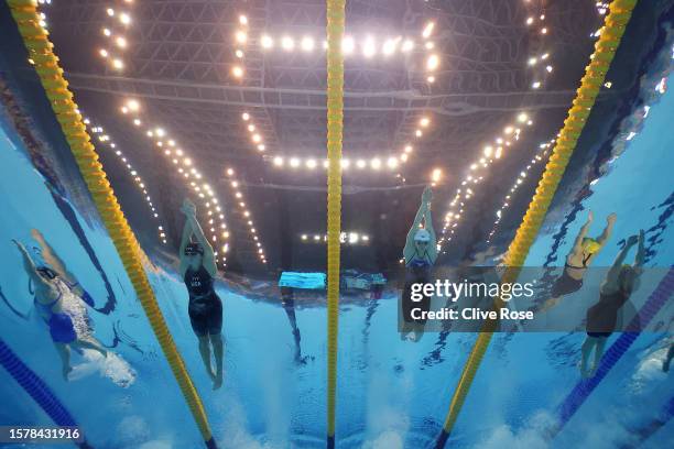 Erika Fairweather of Team New Zealand, Katie Ledecky of Team United States, Bingjie Li of Team China and Ariarne Titmus of Team Australia compete in...