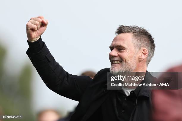 Graham Alexander the head coach / manager of MK Dons celebrates the 3-5 victory during the Sky Bet League Two match between Wrexham and Milton Keynes...