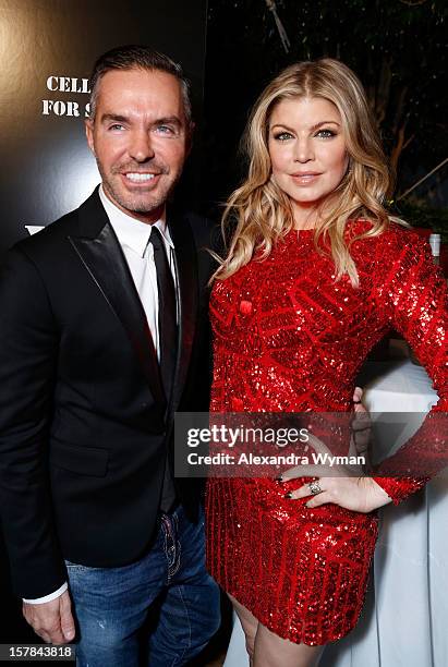 Dsquared Founder Dan Caten and Host Fergie attend Voli Light Vodka's Holiday Party hosted by Fergie Benefiting Cellphones for Soldiers at SkyBar at...