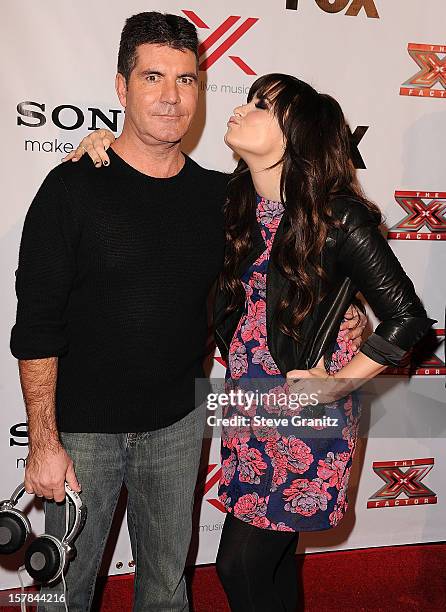 Simon Cowell and Demi Lovato arrives at the "The X Factor" Viewing Party Sponsored By Sony X Headphones at Mixology101 & Planet Dailies on December...