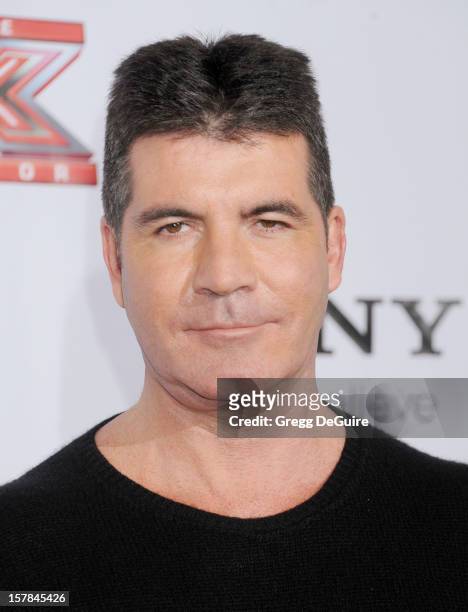 Personality Simon Cowell arrives at FOX's "The X Factor" viewing party at Mixology101 & Planet Dailies on December 6, 2012 in Los Angeles, California.
