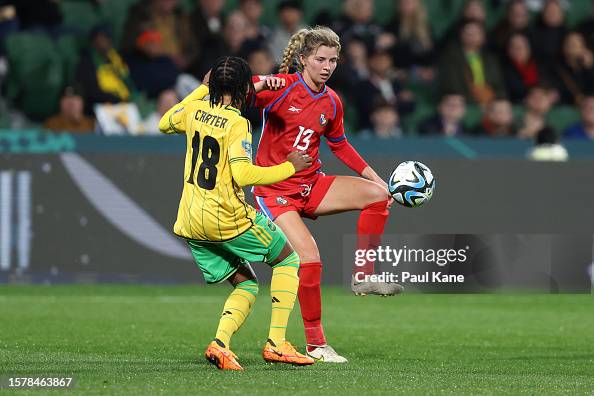 Riley Tanner of Panama controls the ball against Trudi Carter of