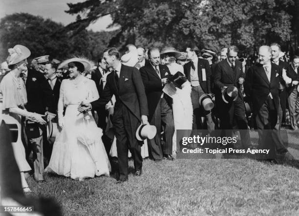 King George VI and Queen Elizabeth attend a garden party at the Château de Bagatelle in the Bois de Boulogne, during their State Visit to Paris,...