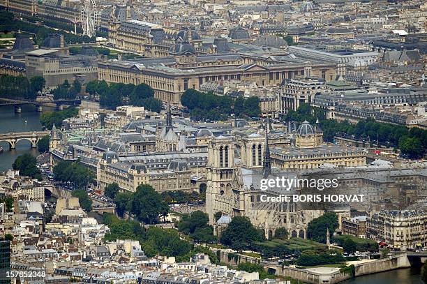 An aerial picture taken aboard an helicopter on July 20, 2010 shows Notre-Dame cathedral in Paris on the Ile de la Cite . Second ground is the Police...