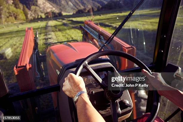 woman's hands steering tractor - agricultural equipment bildbanksfoton och bilder