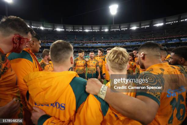 Quade Cooper of the Wallabies talks to team mates in a huddle after losing The Rugby Championship & Bledisloe Cup match between the Australia...