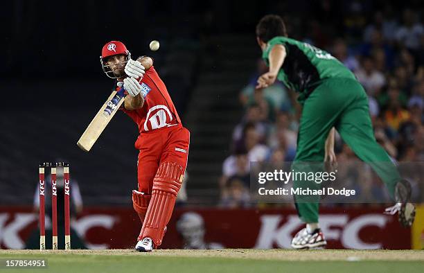 Faf Du Plessis of The Renegades hits the ball and is dropped by Shane Warne of The Stars drops during the Big Bash League match between the Melbourne...