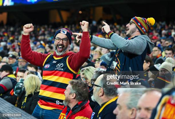 Crows fans celebrates a goal during the round 20 AFL match between Adelaide Crows and Port Adelaide Power at Adelaide Oval, on July 29 in Adelaide,...