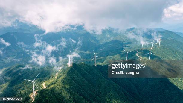wind power generation cloud sea on mountain - mill hill stock pictures, royalty-free photos & images