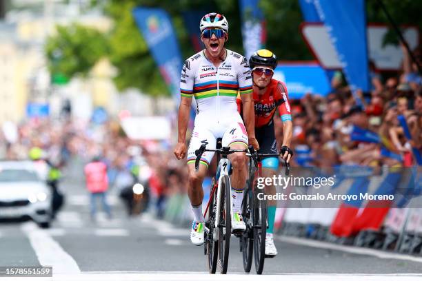 Remco Evenepoel of Belgium and Team Soudal - Quick Step celebrates at finish line as stage winner ahead of Pello Bilbao of Spain and Team Bahrain -...