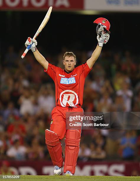 Aaron Finch of the Renegades celebrates as he reaches his century during the Big Bash League match between the Melbourne Renegades and the Melbourne...