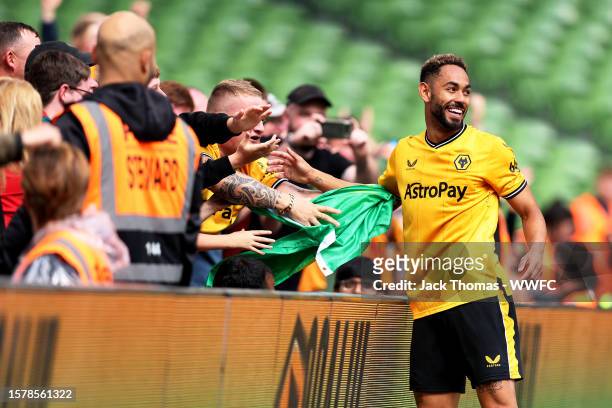 Matheus Cunha of Wolverhampton Wanderers celebrates after scoring his team's first goal with fans during the pre-season friendly match between Celtic...