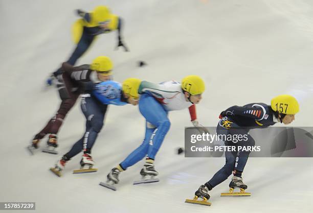 Kim Yun-Jae of South Korea leads in the men's 1000m heats in the Samsung ISU World Cup Short Track Speed Skating event in Shanghai on December 7,...