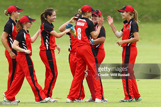 Rhianna Peate of the Scorpions is congratulated by team-mates after taking a catch off Renee Chappell during the Women's Twenty20 match between the...