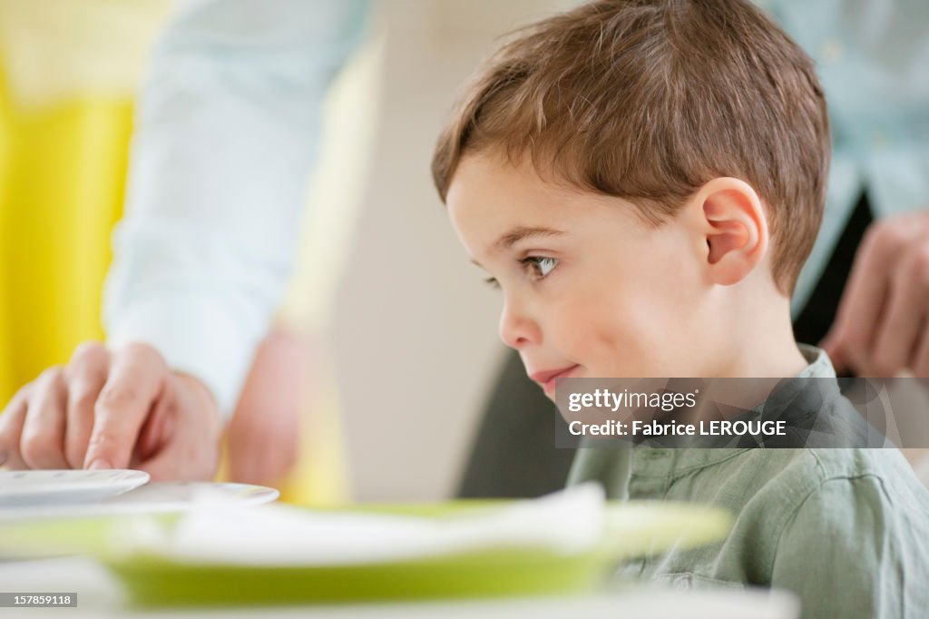 Boy sitting at a dining table