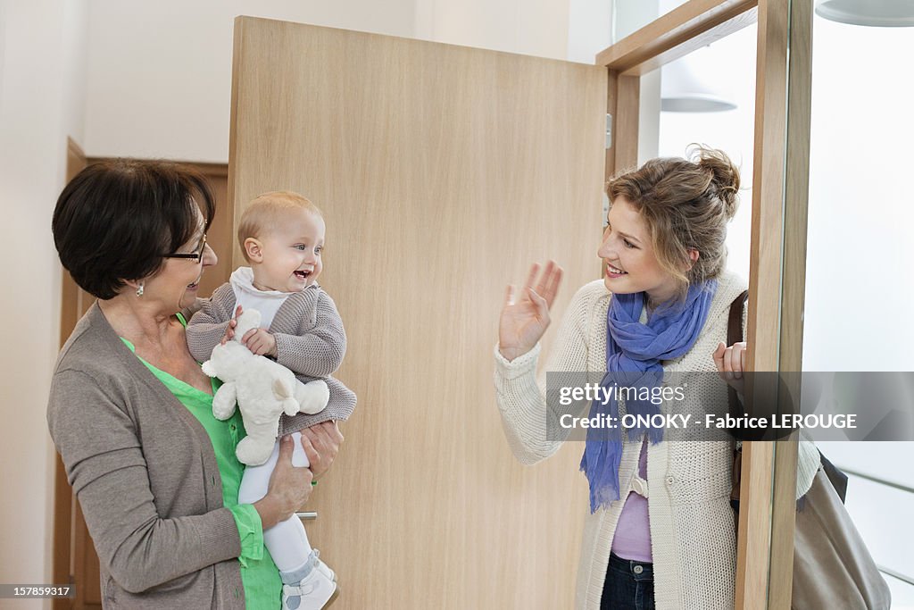 Woman waving to her daughter
