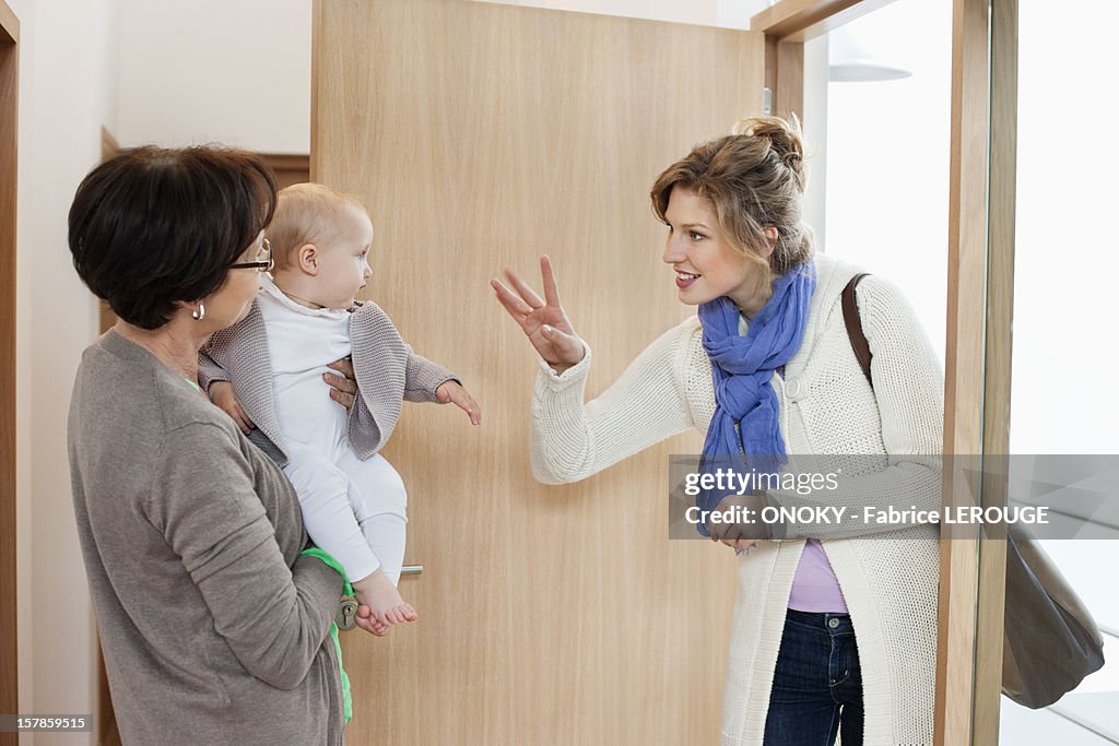 Woman waving to her daughter