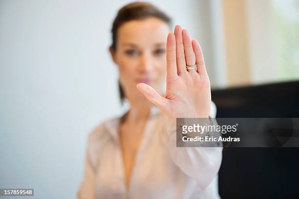 businesswoman showing her wedding ring with stop gesture - basta foto e immagini stock