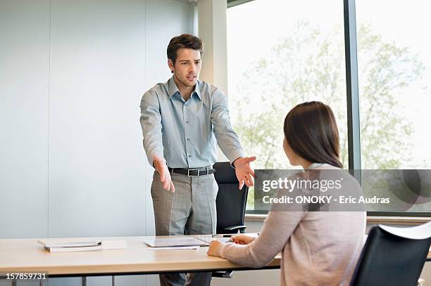 business executive discussing with his client - raid stockfoto's en -beelden