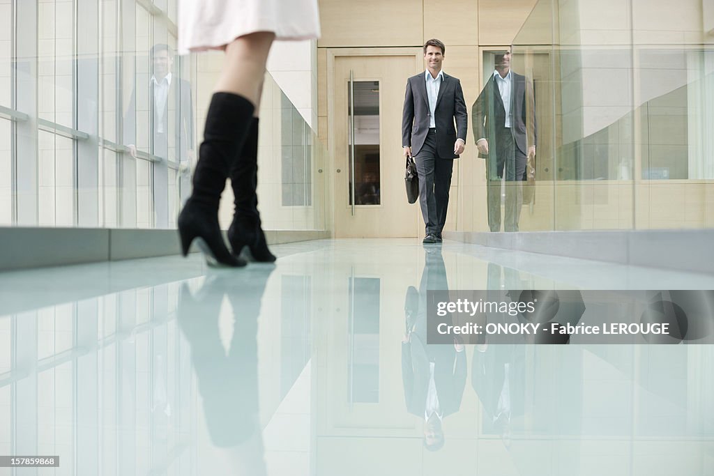 Business executives walking in a corridor