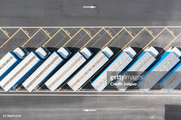 the truck parking lot is full of trucks - trucks in a row stock pictures, royalty-free photos & images