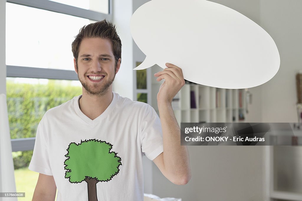 Man holding a speech bubble