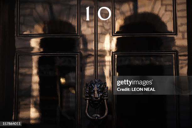 The front door of 10 Downing Street is pictured in London, on May 5, 2010. Party leaders criss-crossed Britain in a frantic final day of election...