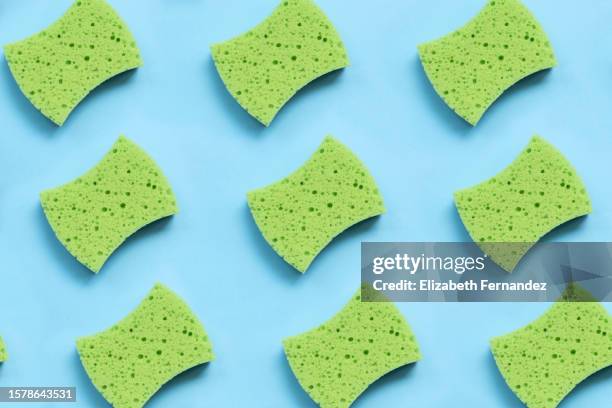 seamless pattern of green sponge on blue background - absorbent stock-fotos und bilder