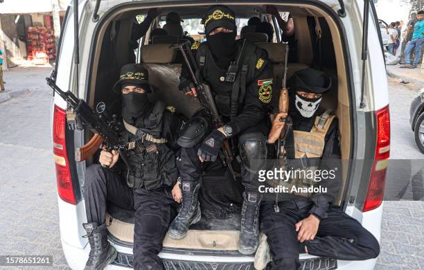 Al-Quds Brigades, the military wing of Palestinian group Islamic Jihad, take part in a military parade on the anniversary of Israel's 2021 operation...
