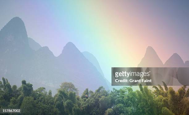 view of rainbow by mountains. - rainbow mountains china stock pictures, royalty-free photos & images
