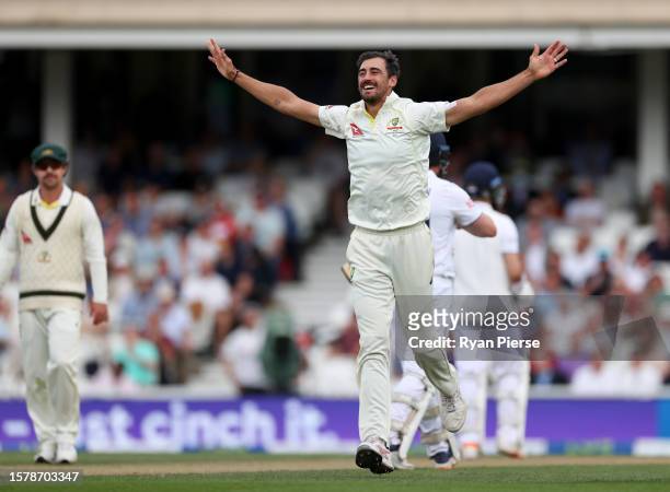 Mitchell Starc of Australia celebrates taking the wicket of Jonny Bairstow during Day Three of the LV= Insurance Ashes 5th Test Match between England...