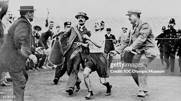 One of the earliest Olympic dramas captured on photo was the marathon runner Dorando Pietri, of Italy, here reaching the tape in the race at the...