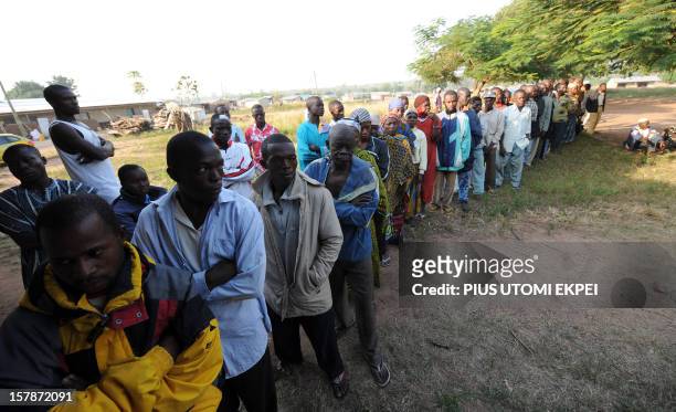 Voters queue to cast their votes at a polling station in Talekura, Bole Bamboi a northern region constituency, on December 7, 2012 as Ghana voted in...