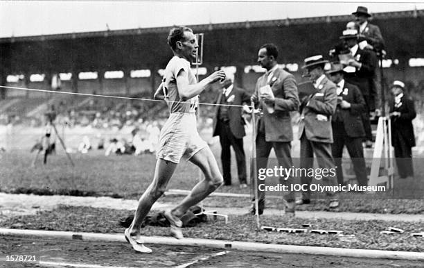 Paavo Nurmi of Finland crosses the finish line to win a race at the 1924 Olympic Games in Paris. In the history of athletics no man has taken so many...