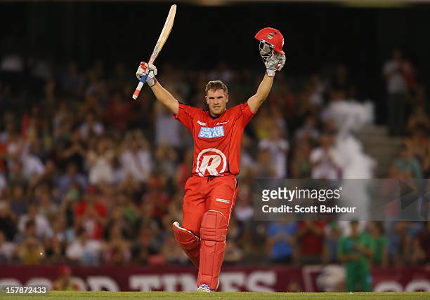 Aaron Finch of the Renegades celebrates as he reaches his century during the Big Bash League match between the Melbourne Renegades and the Melbourne...