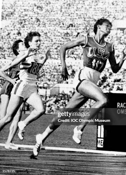 Wilma Rudolph of the USA beats Dorothy Hyman of Great Britain into second place to win the 100 metres final at the 1960 Olympic Games in Rome....