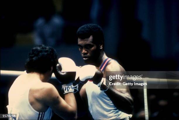 Teofilo Stevenson of Cuba focuses intently on his opponent during a heavy weight bout in the 1980 Summer Olympic Games held in Moscow, USSR....