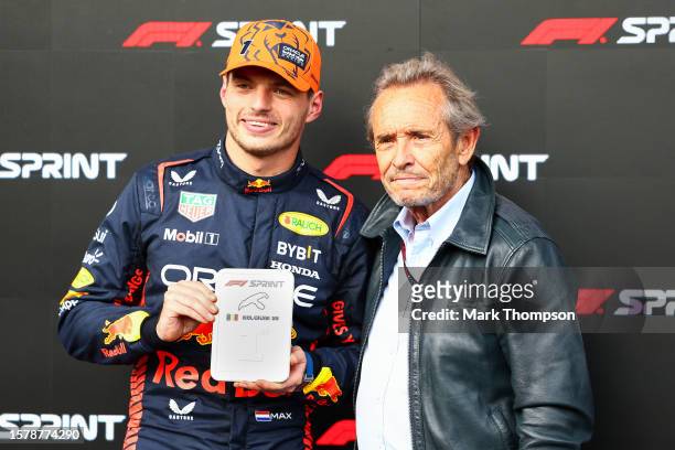 Sprint winner Max Verstappen of the Netherlands and Oracle Red Bull Racing is presented with his trophy by Jacky Ickx in parc ferme during the Sprint...