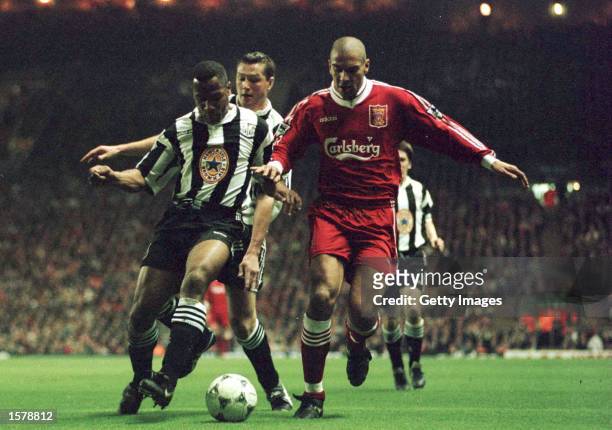 Stan Collymore of Liverpool battles for the ball with Les Ferdinand of Newcastle United during their FA Premiership game at Anfield, Liverpool....