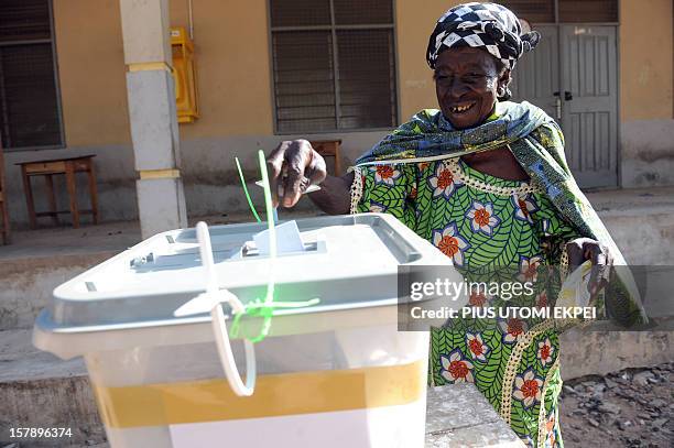 An elderly woman casts her ballot at the Bole polling station, in the Bole Bamboi constituency of northern Ghana, on December 7, 2012. Ghana voted in...