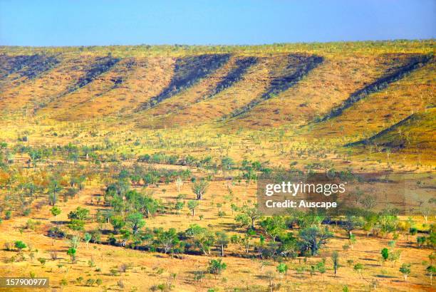 Escarpment and dry creekline weaving across a broad savannah valley in the central Kimberley Plateau, Marion Downs Wildlife Sanctuary, northern...