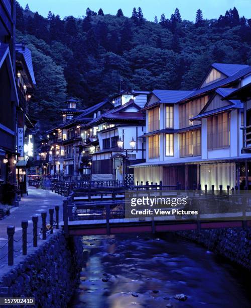 Ginzan Onsen Fujiya, Yamagata, Japan, Architect Kengo Kuma & Associates, Ginzan Onsen Fujiya Overall Exterior View At Twilight.