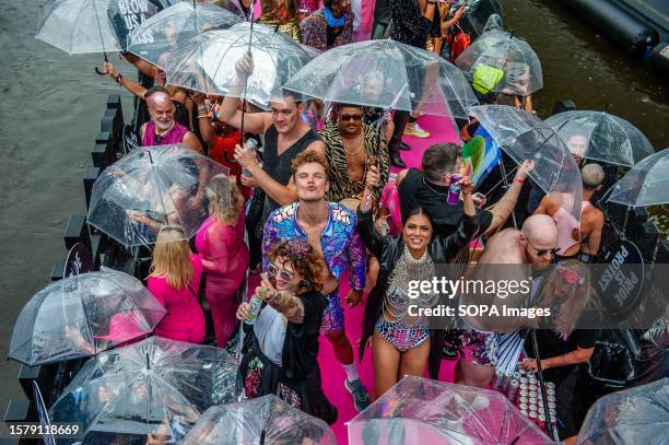 People from one of the boat are seen throwing kisses to the audience during the event. The Canal Parade starts around noon and takes all afternoon....