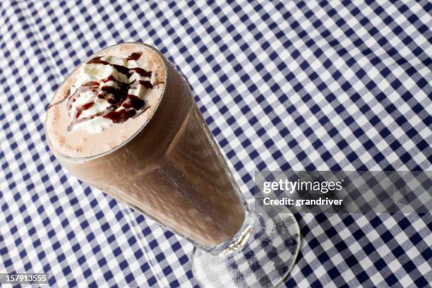 chocolate milkshake on blue gingham - chocolate milkshake stock pictures, royalty-free photos & images