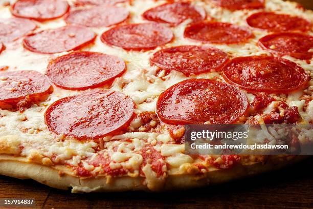 thin crust pizza - pepperoni pizza stock pictures, royalty-free photos & images