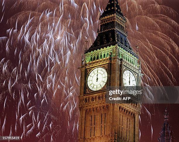 Fireworks explode over the River Thames lighting up the sky as Big Ben strikes midnight and the start of the Millenium for London, 01 January 2000.